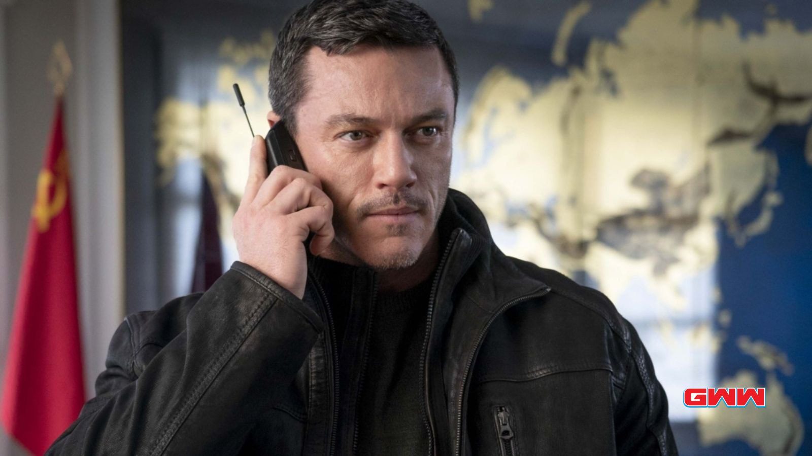 Luke Evans as John Lawlor on the phone in Weekend in Taipei