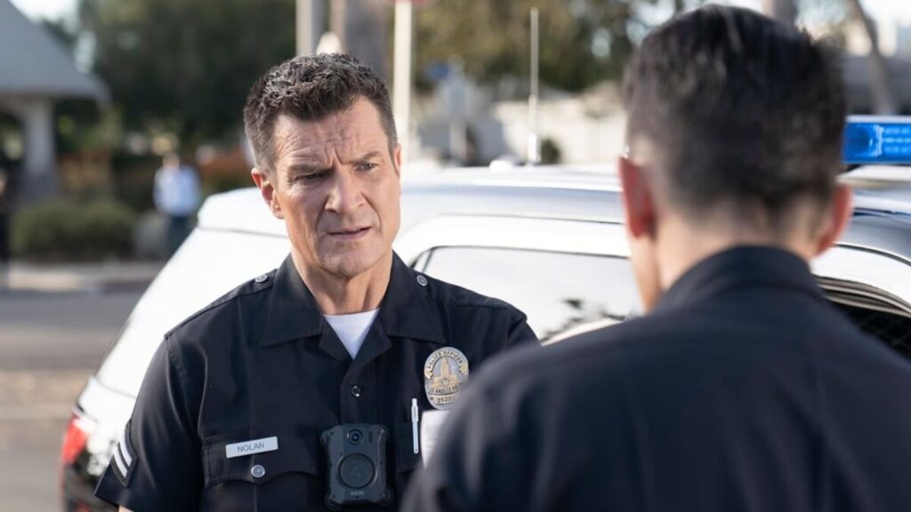 Nathan Fillion as John Nolan talking to fellow officer in The Rookie season 7