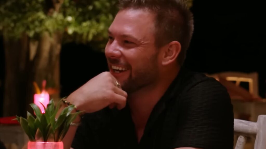 Jo&atilde;o Franco laughing during a relaxed evening chat in Below Deck Down Under Season 4
