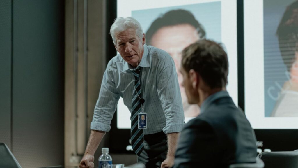 Richard Gere confronting Michael Fassbender in briefing room, from The Agency season 1