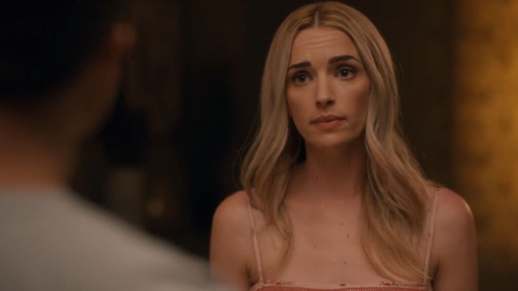 Brianne Howey facing confrontation in dimly lit room scene, from Ginny and Georgia season 3