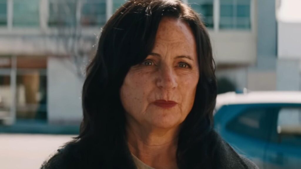 Alexa Demie serious expression standing outside suburban street background in Euphoria Season 3