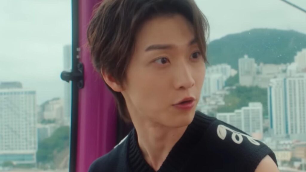 Sang Heon Lee as Min Ho reacting with surprise inside room in XO Kitty Season 3