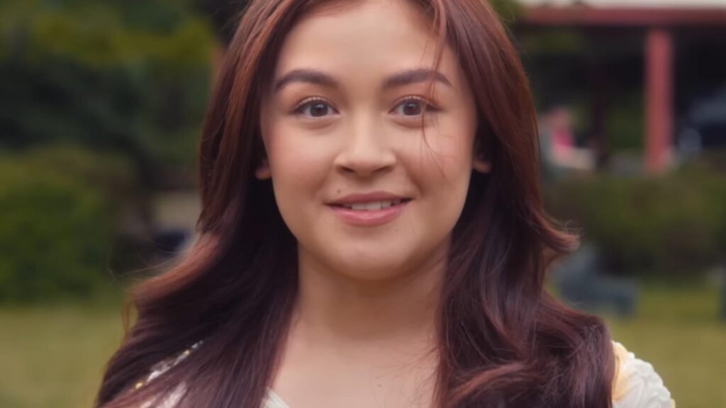 Anna Cathcart as Kitty Covey looking hopeful outdoors in XO Kitty Season 3