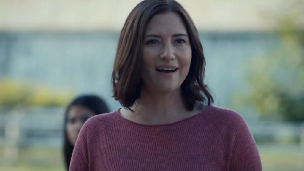 Chyler Leigh smiling outdoors by water in The Way Home Season 4
