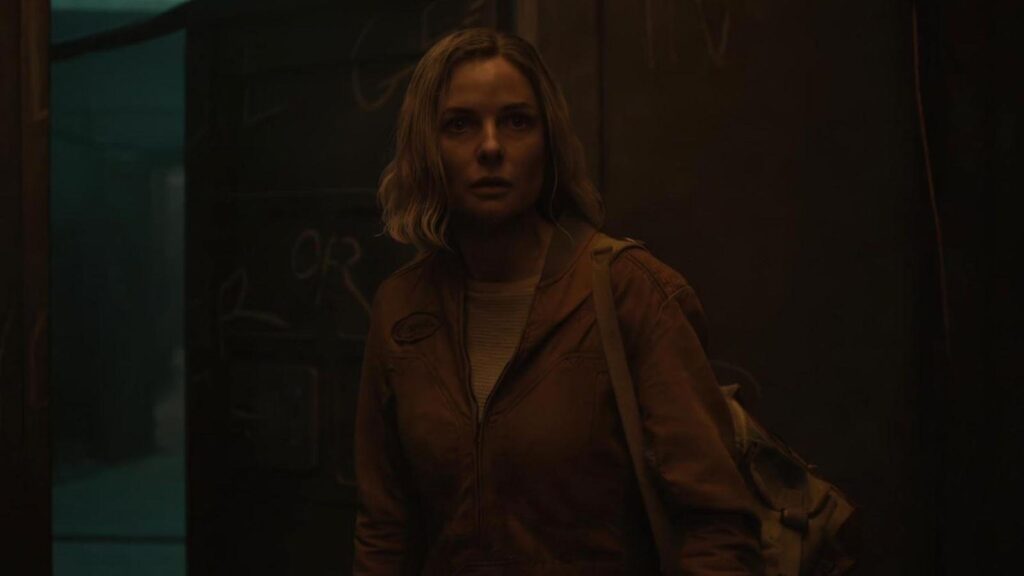 Juliette Nichols played by Rebecca Ferguson inside silo dim corridor scene, from Silo season 2