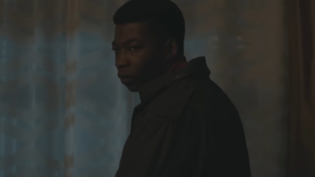 Mekai Curtis as Kanan Stark in Power Book III: Raising Kanan Season 5 standing in shadows