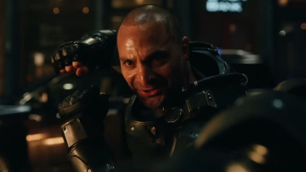 Michael Mando as Scorpion armored villain close up threatening expression dark setting, from Spider-Man Brand New Day