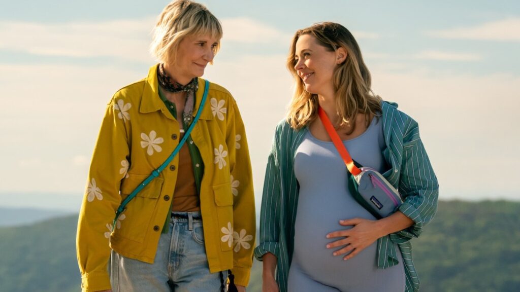 Kerri Kenney and Erika Henningsen walking together outdoors in The Four Seasons season 2