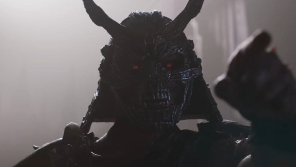 Martyn Ford as Shao Kahn horned helmet glowing eyes confrontation in Mortal Kombat 2