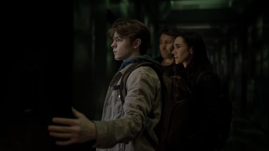 Oakes Fegley stands with Joel Edgerton and Jennifer Connelly in corridor, from Dark Matter seaosn 2