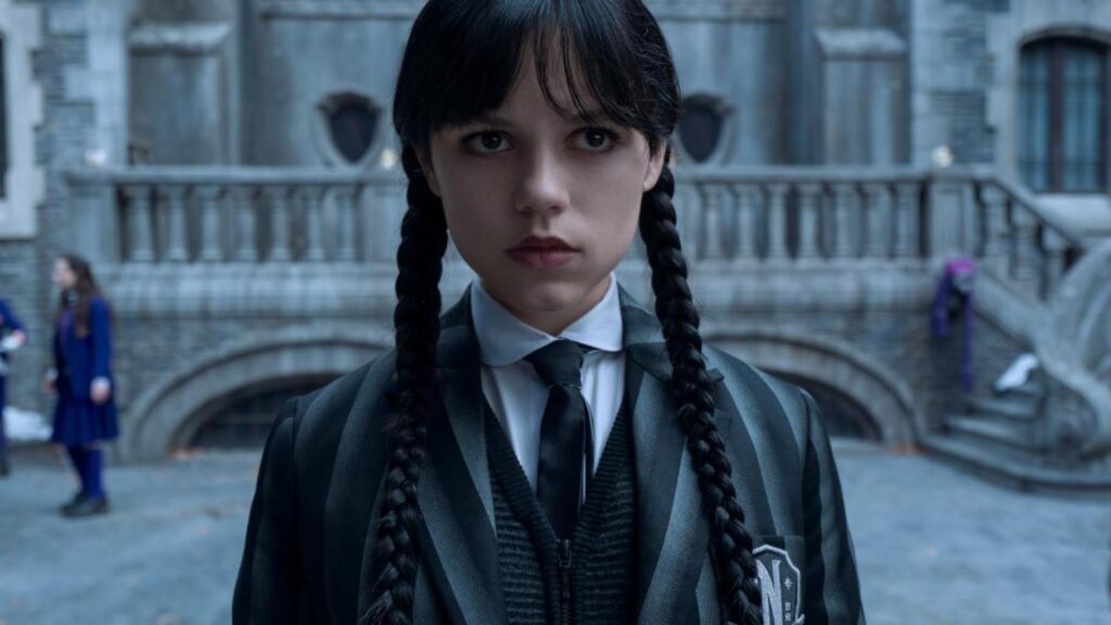 Jenna Ortega as Wednesday Addams in Nevermore courtyard gothic uniform portrait in Wednesday season 3