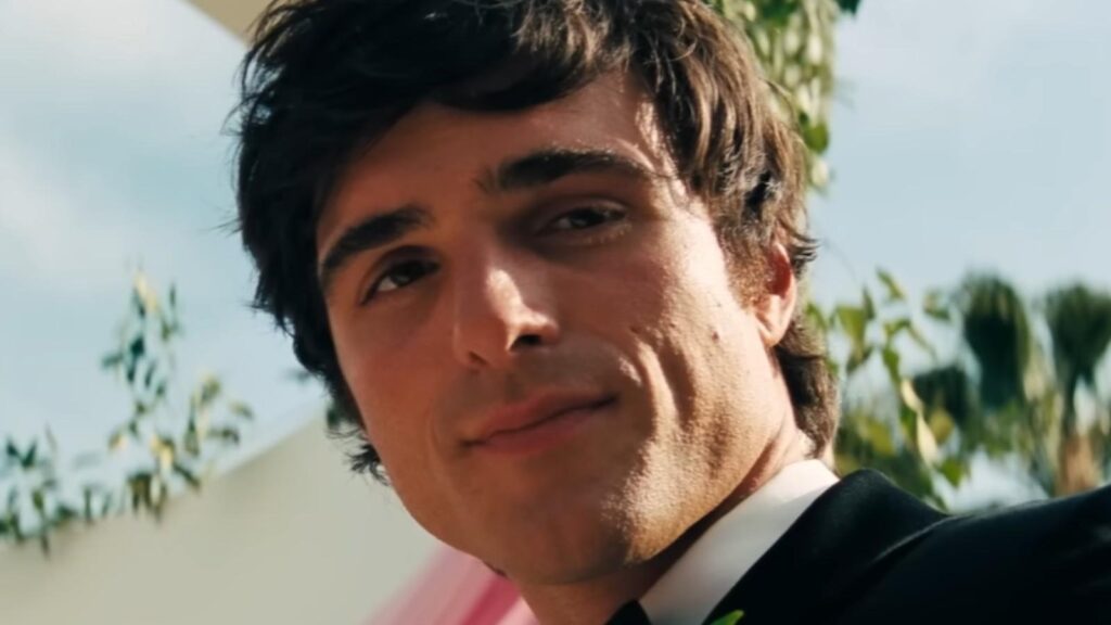 Jacob Elordi smirking outdoors in suit sunlight in Euphoria Season 3