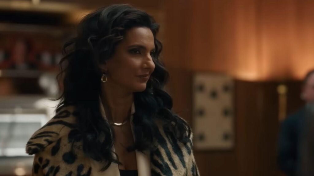 Poorna Jagannathan smiles during casino meeting scene, from Deli Boys season 2