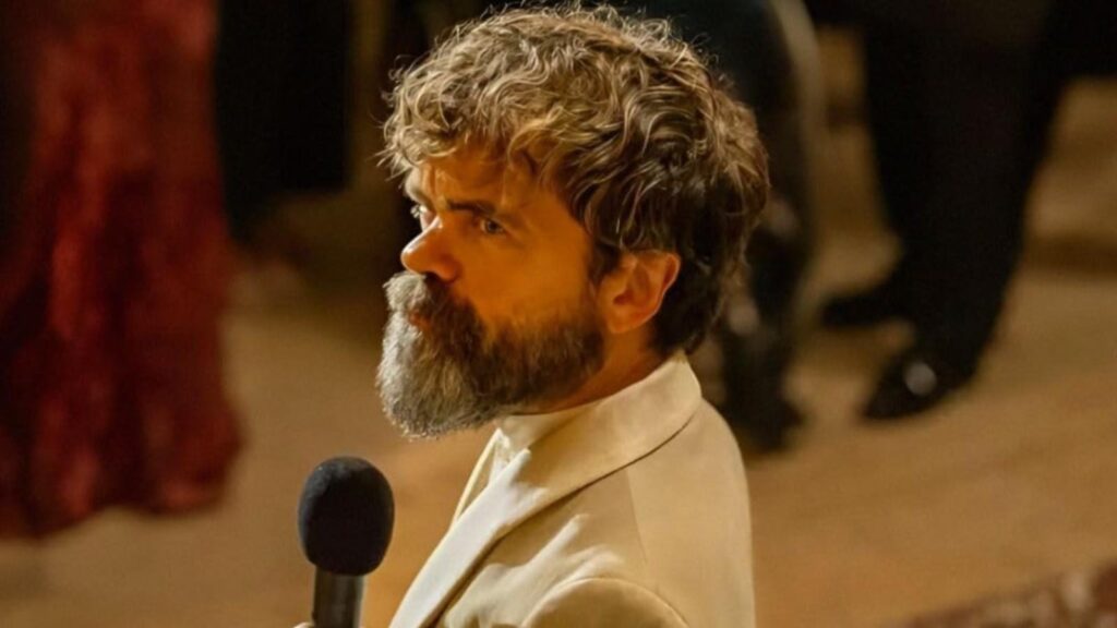 Peter Dinklage as Leon Prater speaking into microphone intense expression in Dexter: Resurrection
