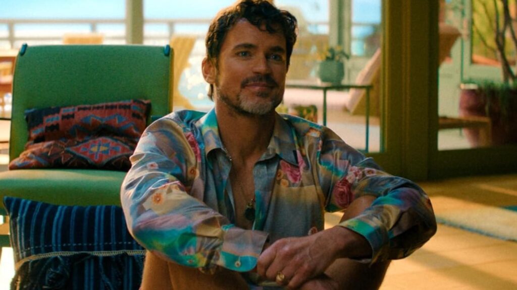 Matt Bomer sitting indoors in a colorful shirt on Outcome