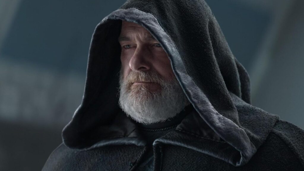 Ray Stevenson as Baylan Skoll in a dark hooded cloak, from Ahsoka