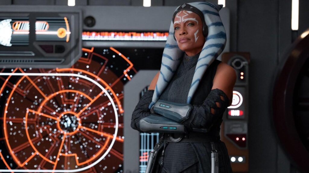 Rosario Dawson as Ahsoka Tano standing near a star map, from Ahsoka