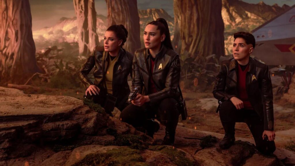 Rebecca Romijn as Una Chin-Rile, Christina Chong as La'an Noonien-Singh, and Melissa Navia as  Lt. Erica Ortegas in Star Trek: Strange New Worlds season 4.