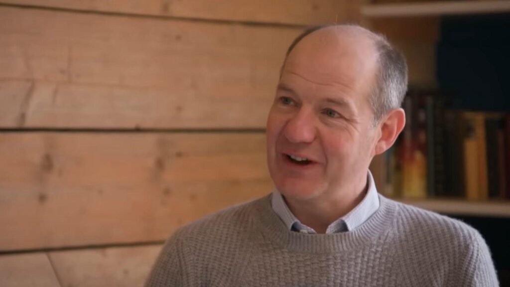 Charlie Ireland smiles during conversation inside rustic farmhouse on Clarkson's Farm season 5