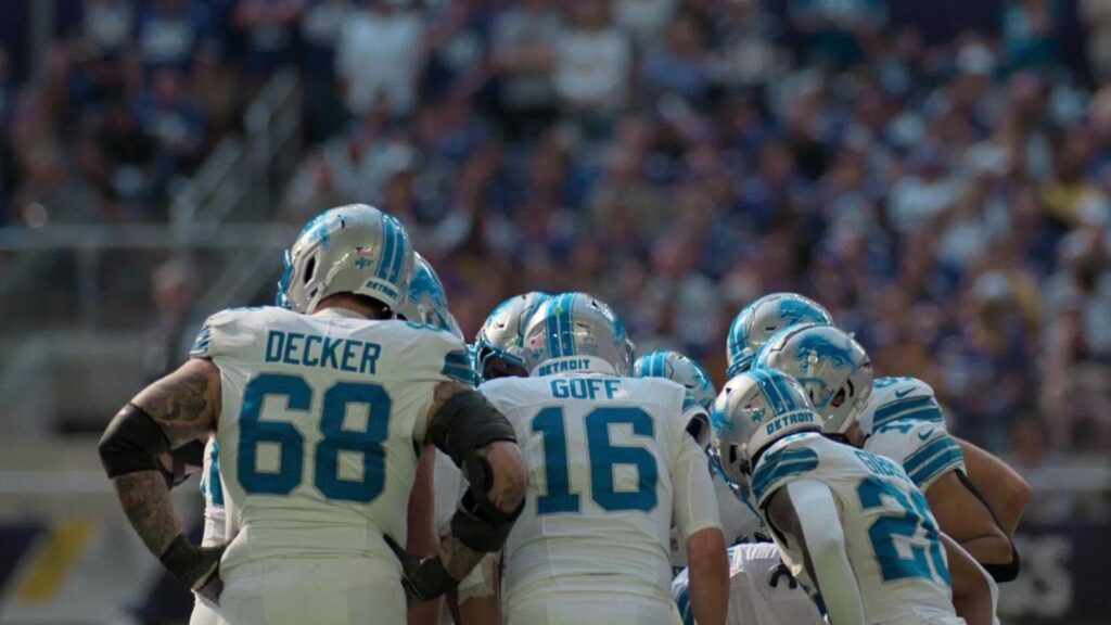 Jared Goff leading Detroit Lions huddle during intense NFL game action, from Quarterback Season 2