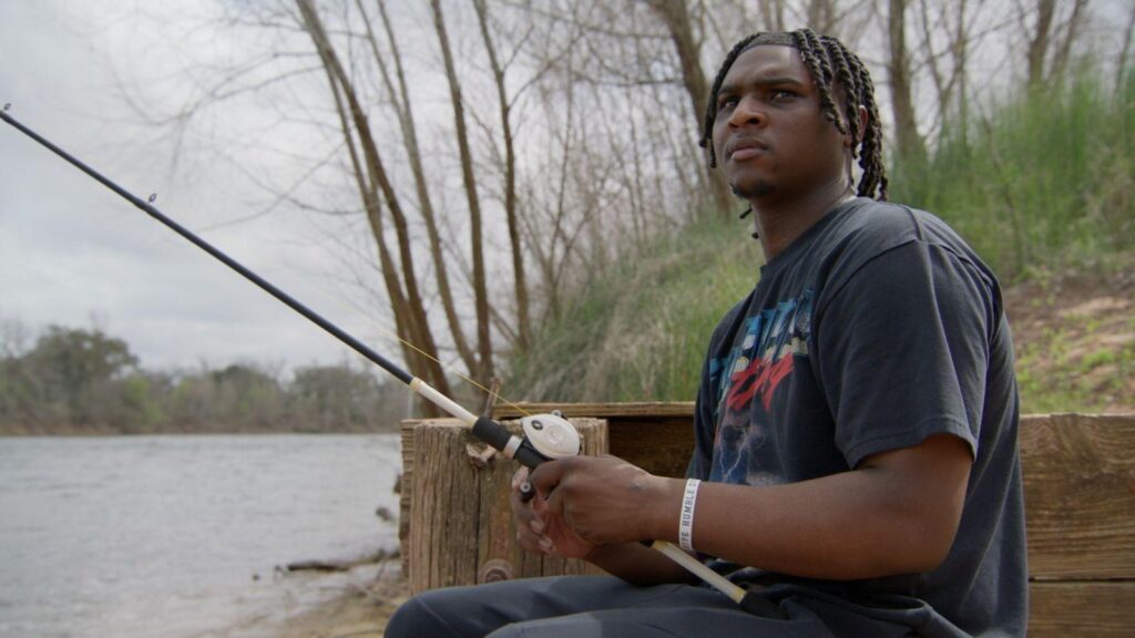 Cam Ward fishing outdoors during reflective moment in Quarterback Season 3