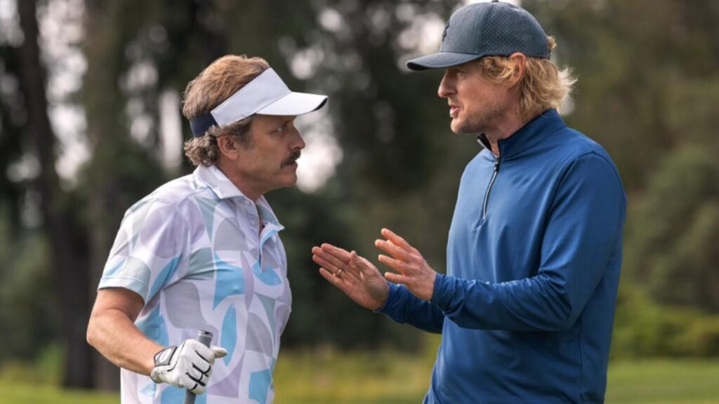 Owen Wilson as Pryce talks with Peter Dager as Santi on the golf course in Stick season 1
