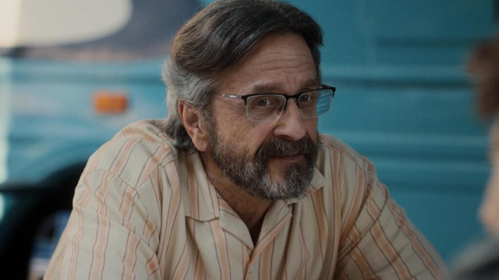 Marc Maron as Mitts smiles during a quiet scene from Stick season 1