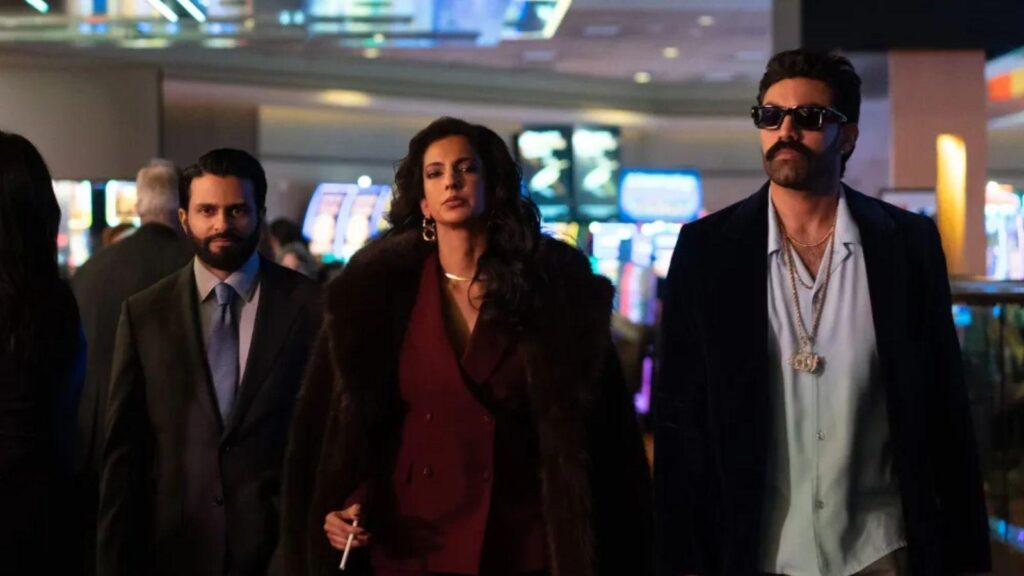 Asif Ali Saagar Shaikh Poorna Jagannathan walk through casino floor scene, from Deli Boys season 2