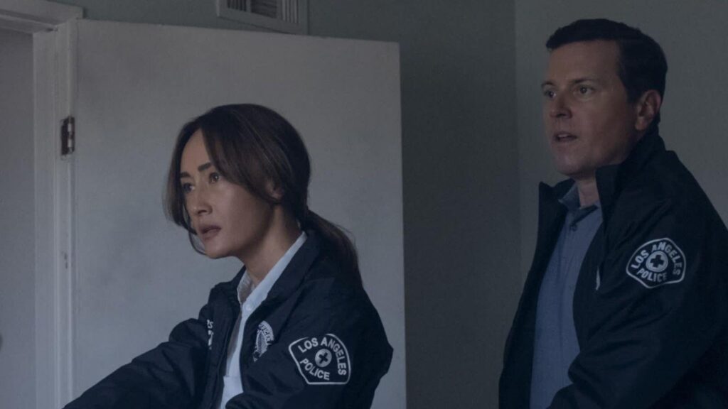 Maggie Q and Michael Mosley investigate a crime scene indoors, from Ballard season 1