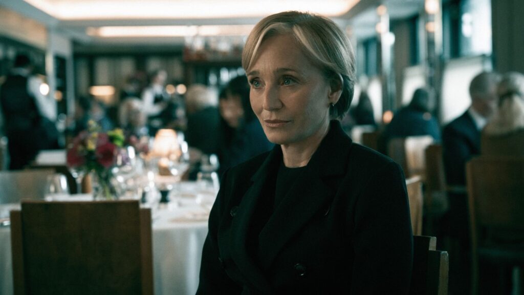 Kristin Scott Thomas sits thoughtfully in restaurant scene from Slow Horses season 6