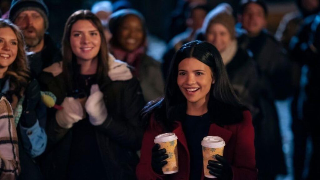 Nikki Rodriguez holding coffees at event, from My Life with the Walter Boys season 2