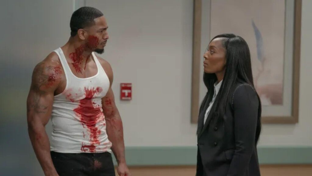 Oshea Russell as Tommy and Racquel Palmer as Blue confronts woman in tense hospital hallway scene, from All The Queen’s Men season 5