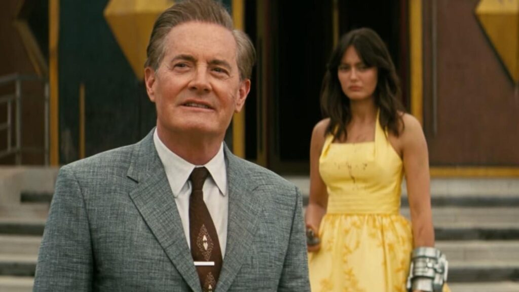 Kyle MacLachlan as Hank MacLean stands before Ella Purnell's Lucy MacLean in Fallout season 2
