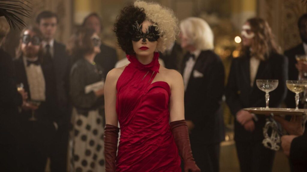 Emma Stone as Estella masked red dress gala ballroom scene, from Cruella