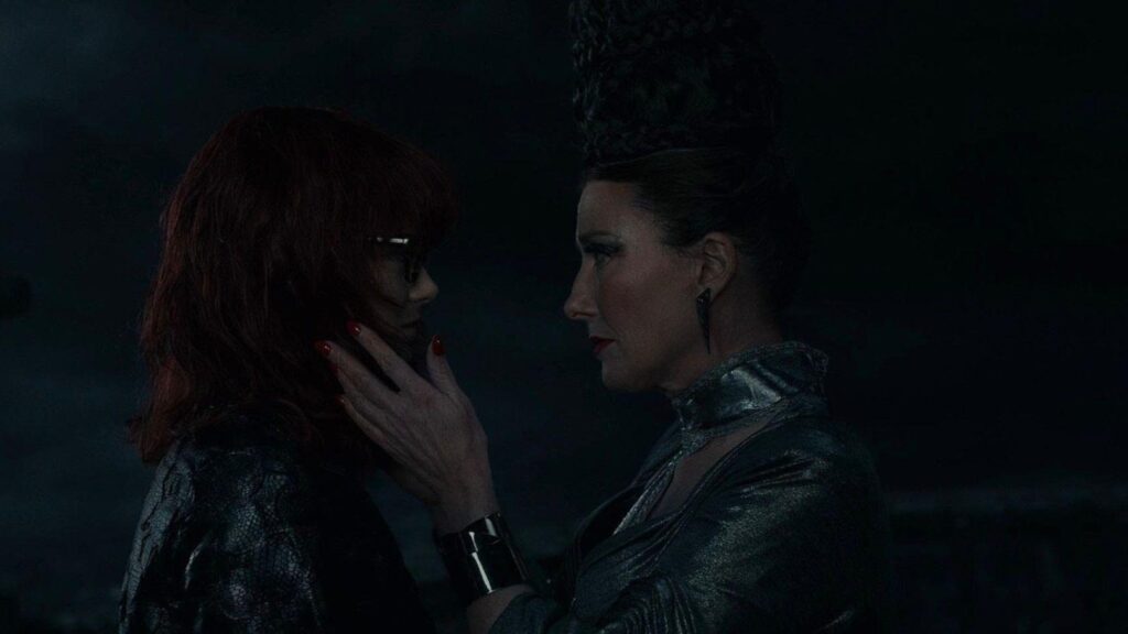Emma Stone as Estella red hair glasses dark transformation scene, from Cruella
