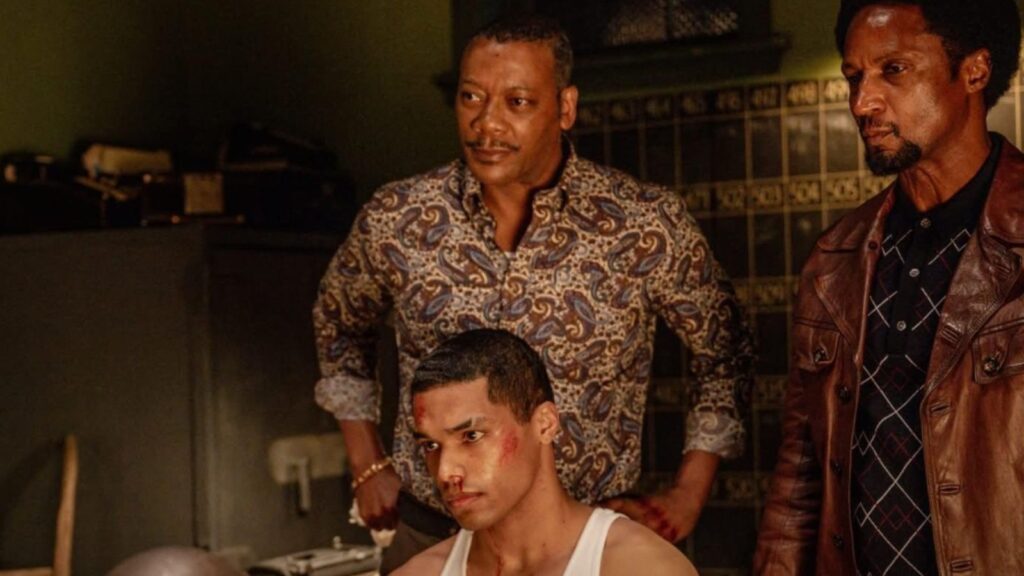Elvis Nolasco and Erik LaRay Harvey confronting Rome Flynn during intense interrogation scene Season 4