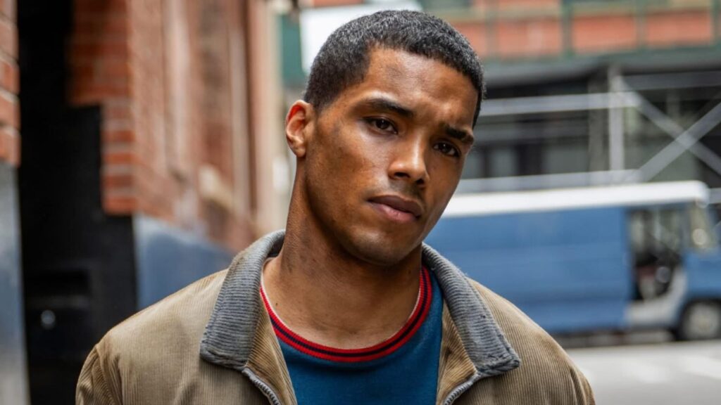 Rome Flynn looking determined on city street in Godfather of Harlem Season 4