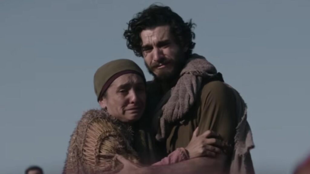 George H Xanthis as John embraces grieving woman during emotional The Chosen Season 6