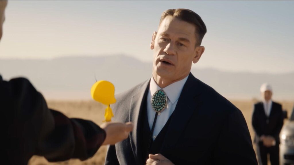 John Cena as Buddy Crane confronts Tweety during a desert scene in Coyote vs. Acme.